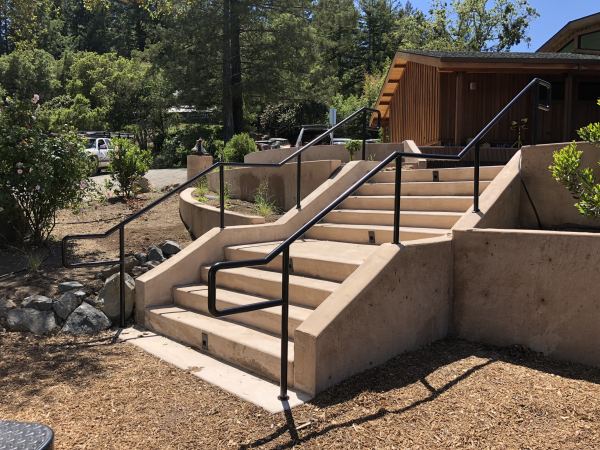 Round Handrails — Handrail constructed from 1 1/4" standard pipe (1 5/8" O.D.) and powder coated black