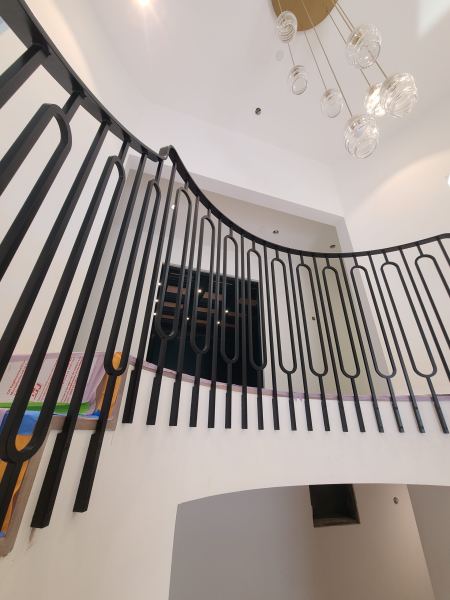 Modern Railing — Modern railing with custom made pickets and heat formed transitions powder coated satin black