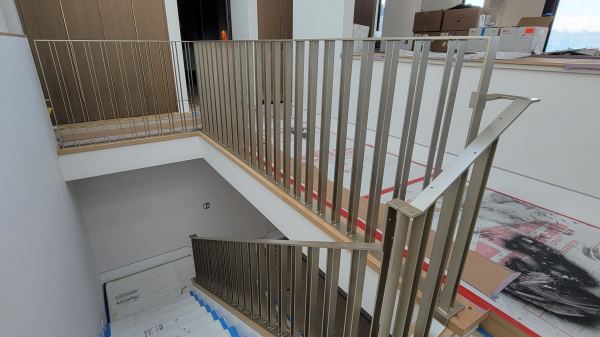 Modern Interior Railing — Fabricated interior stair railing merges functionality with modern architectural design, features: 3/8” x 2” flat bar rail cap, countersunk screw holes for wood cap ¼” x 1 ½” flat bar pickets, picket spacing patter...