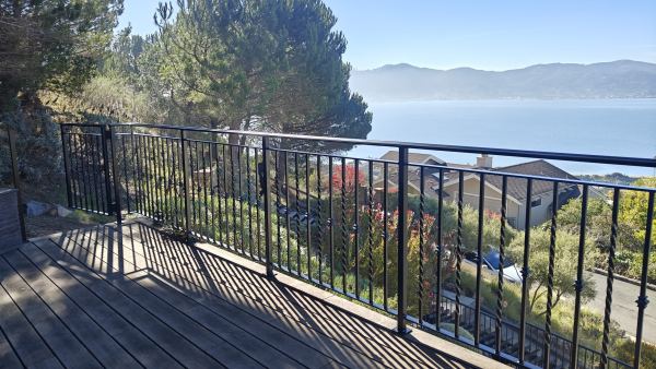 Deck Railing — Custom-fabricated deck railing engineered for strength, safety, and architectural impact, featuring: 1 ½” x ½” x 1/8” “C” channel underlayment 1 ½” x 1 ½” x .120” tube steel posts 3/8” x 1 ½” flat bar bottom rail 5/8” x 5/8”...