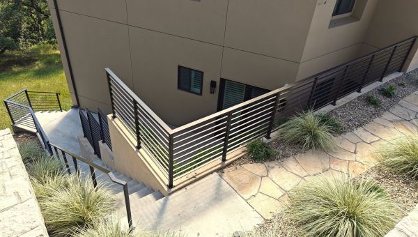 Exterior Horizontal Railing — Exterior horizontal railing, featuring: 3" x 1" x .120" rectangle tube steel rail cap 2" x 2" x .120" square tube steel end posts, face mounted 1" x 1/2" x .060" horizontal rectangle tube steel pickets Statuary...